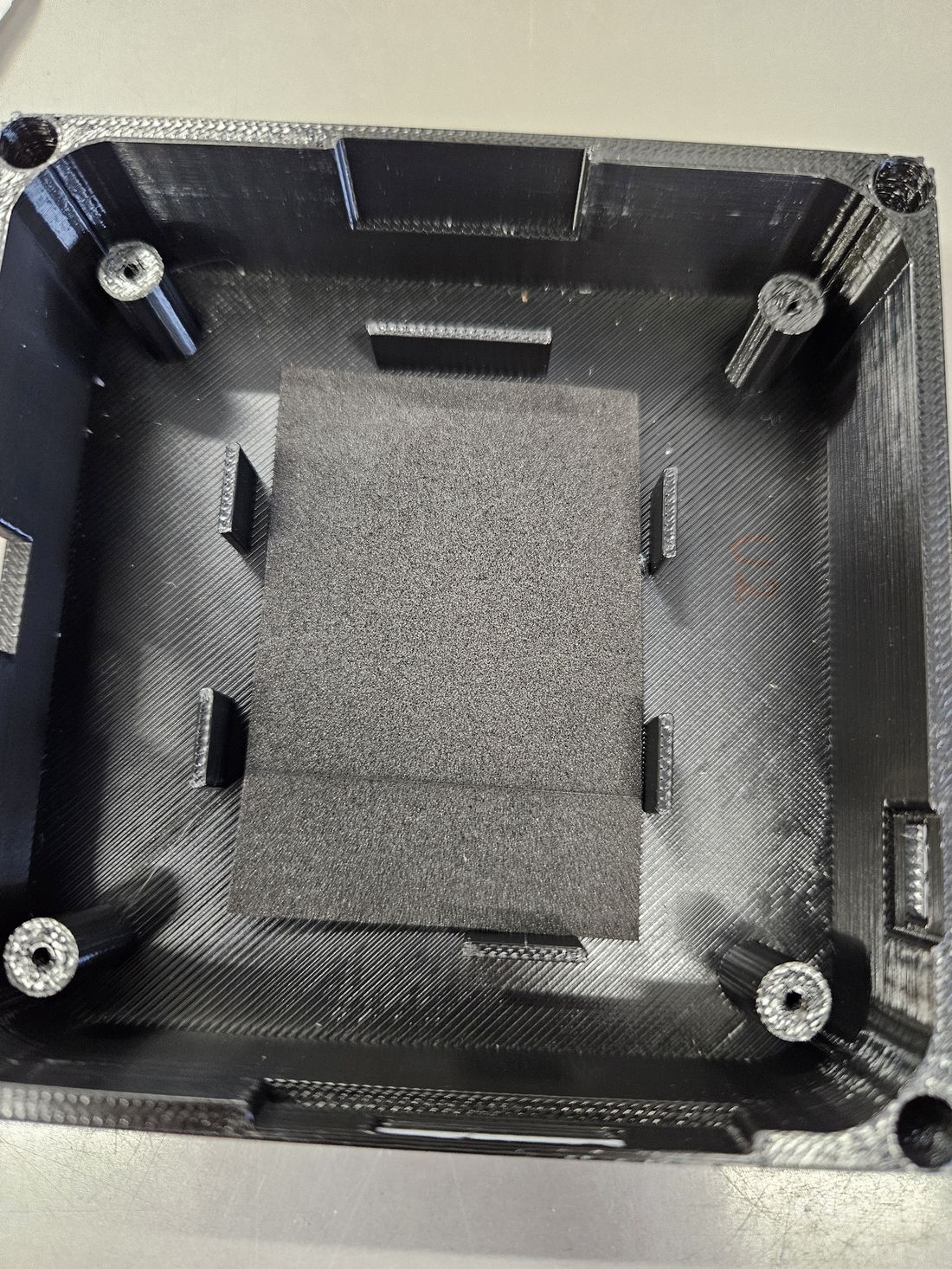 Battery foam pad in